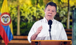 When asked if making marijuana legal could offer a way forward, President Juan Manuel Santos said it could and that he would support it.  (Photo by EPA/Felipe Ariza)